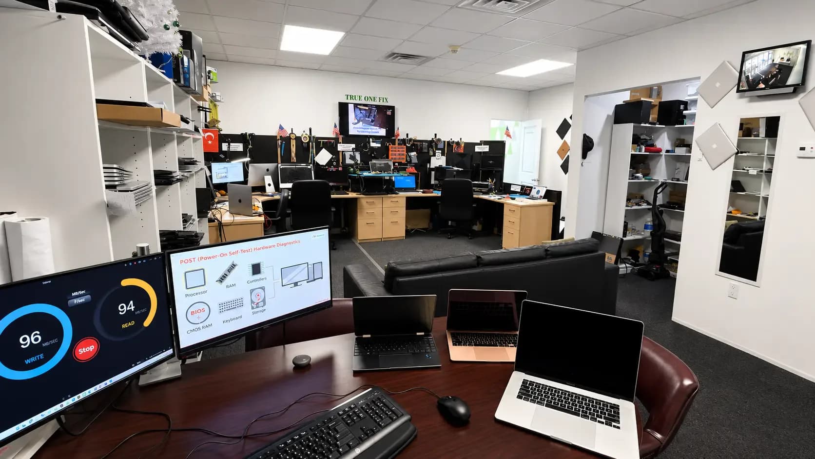 Technician repairing a school computer at a Tampa workshop