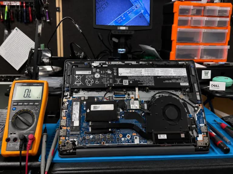 Laptop being inspected for a USF student computer repair discount in Tampa