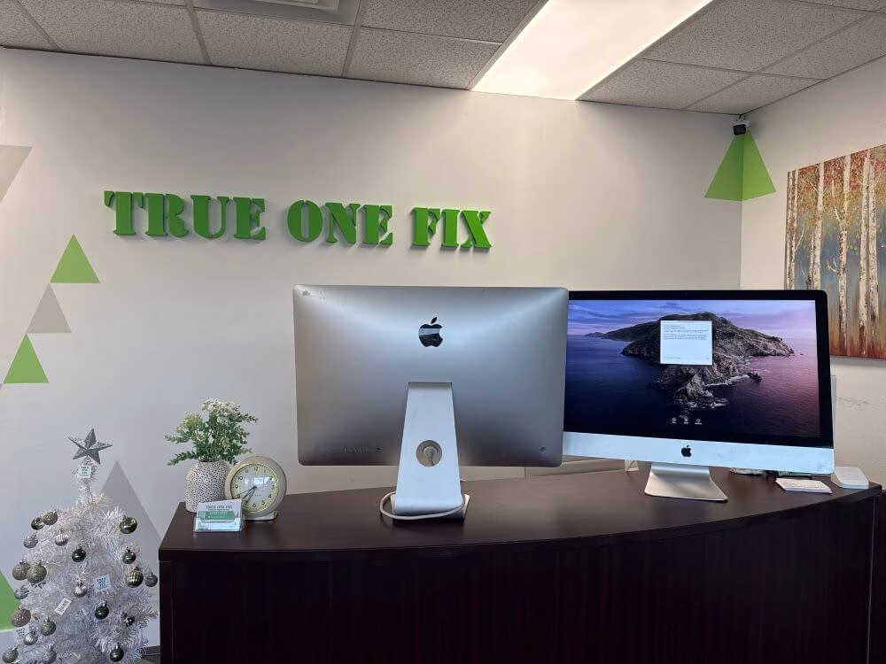 iMac repair technician performing internal diagnostics on an iMac at Trueonefix Computer Repair Shop in Tampa